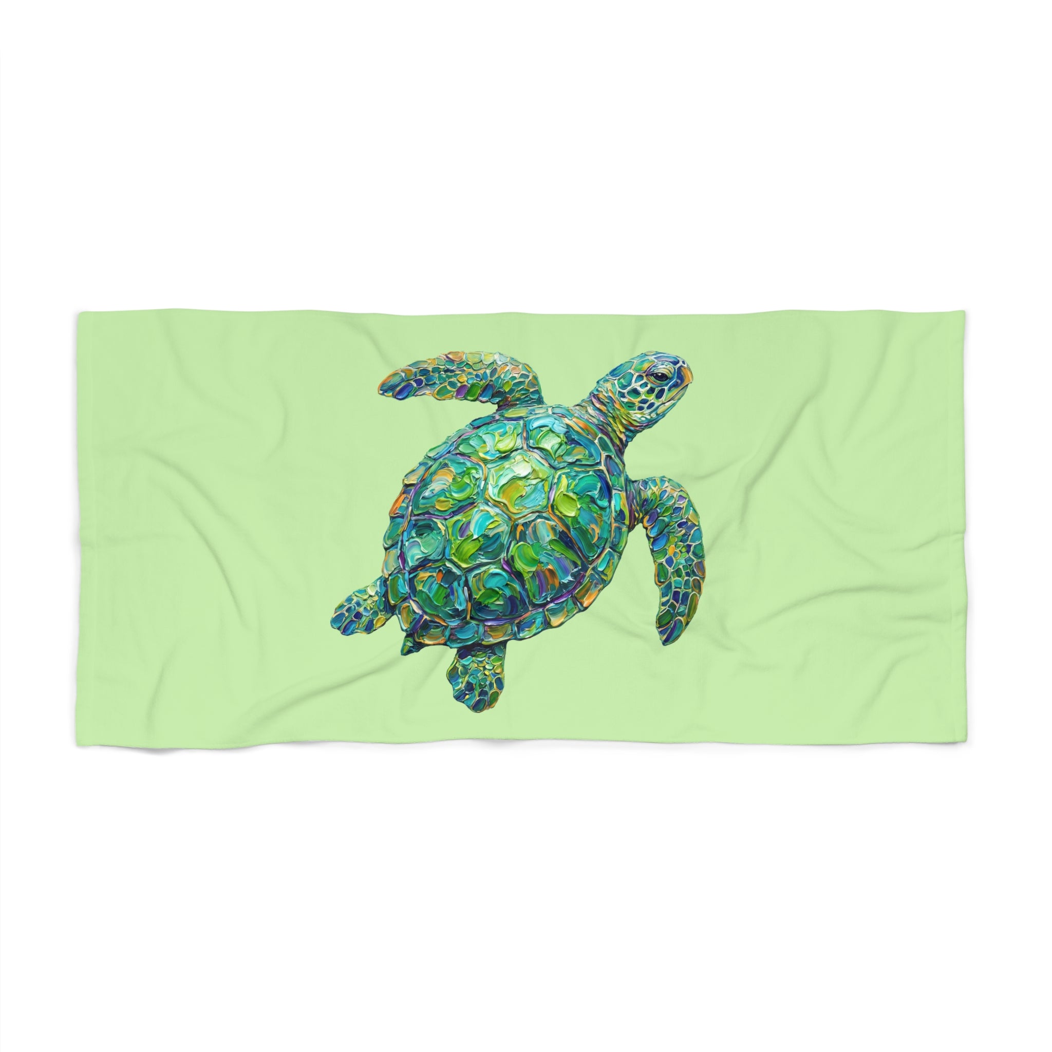 Beach towel printed with a colorful painterly sea turtle in dreamy ocean water